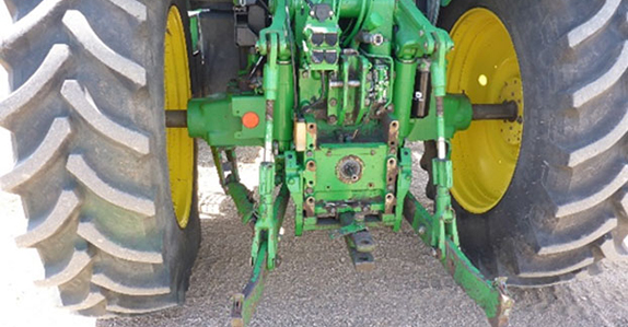 Inspecting farm tractors for sale.