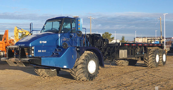 2003 Caterpillar 740 articulated bed truck sold at Ritchie Bros. auction 2003 Caterpillar 740 articulated bed truck sold at Ritchie Bros. auction